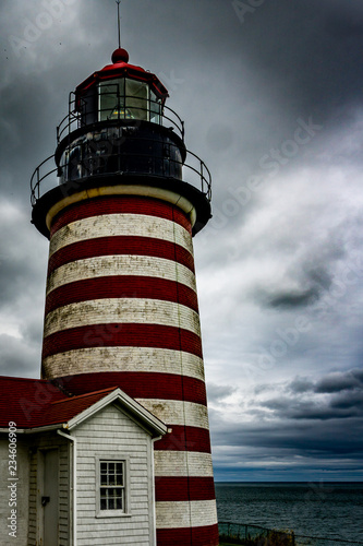 lighthouse on background of stormy sky