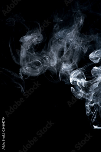 white smoke on black background © adisak