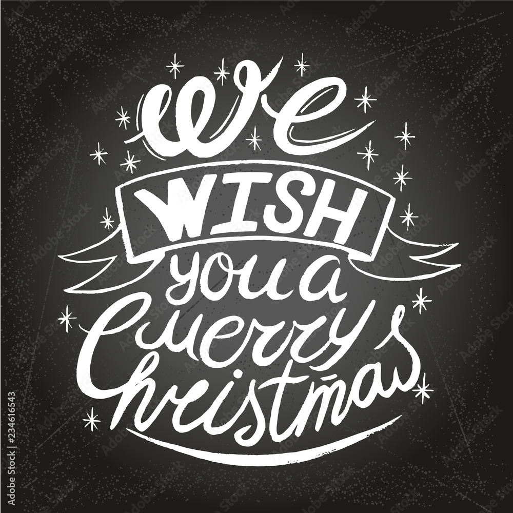 Wishing You A Merry Christmas And Happy New Year Typographical Background On Chalkboard Wishing You A Merry Christmas And Happy New Year Typographical Background On Chalkboard