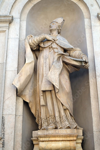 Saint Donatus on the facade of Santi Paolino e Donato church in Lucca, Tuscany, Italy photo