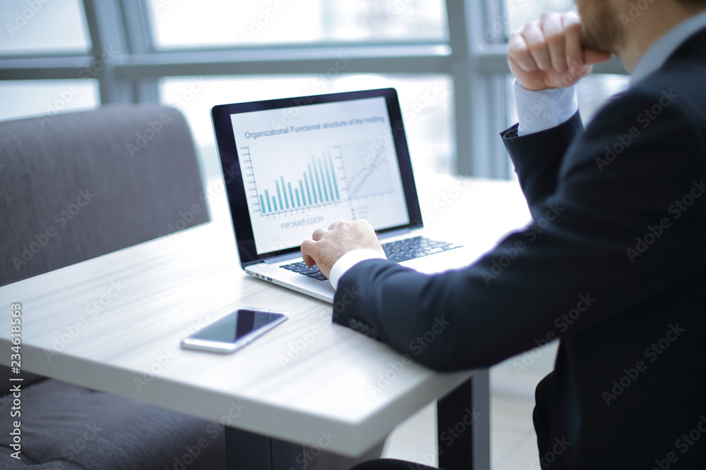 businessman working with financial data on the laptop. businessman working with financial data on the laptop.