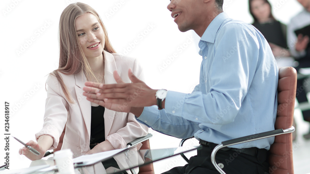Fototapeta premium young business colleagues talking behind a Desk