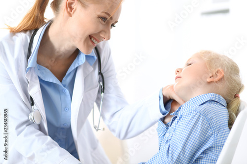 Doctor and a little blonde girl. Medicine and healthcare concept