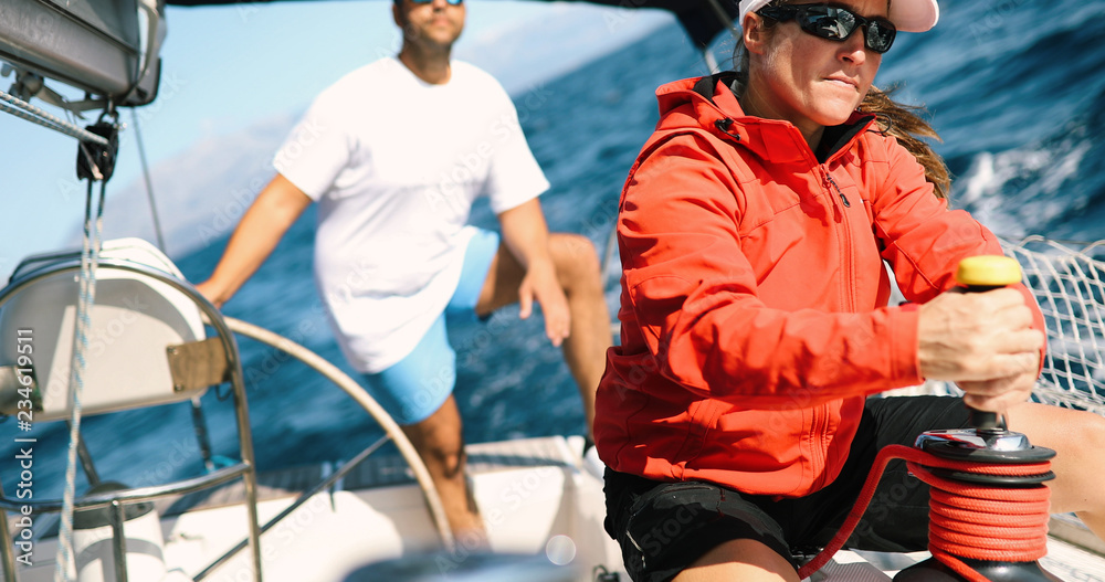 Couple sailing in sea at sunny day Couple sailing in sea at sunny day