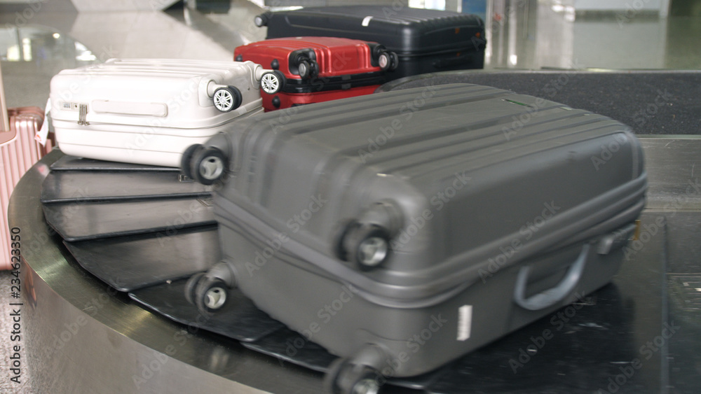 Airport baggage claim with luggage spinning around conveyor Stock Photo ...