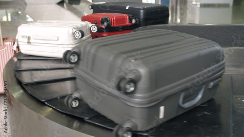 Fototapeta Naklejka Na Ścianę i Meble -  Airport baggage claim with luggage spinning around conveyor