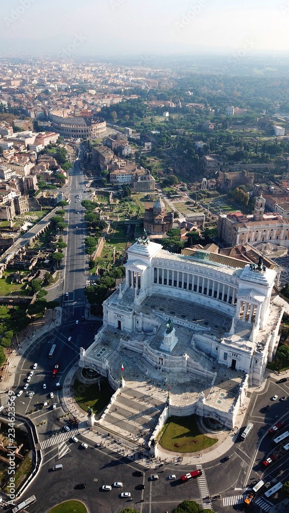 Aerial drone view of iconic neoclassic building of Altar of the Fatherland - Altare della Patria, known as the national Monument to Victor Emmanuel II in city of Rome, Piazza Venezia, Italy
