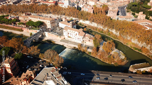Aerial drone photo of famous Tiber river Island or Isola Tiberina in city of Rome, Italy photo