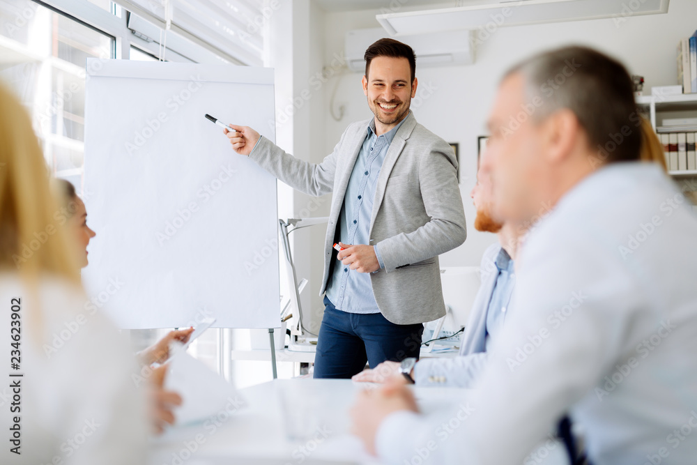 Group of business people working as team in office Group of business people working as team in office
