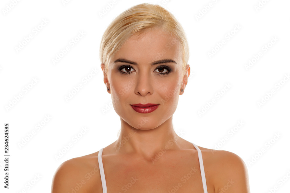 Portrait of young beautiful blonde woman with makeup on white backgeound Portrait of young beautiful blonde woman with makeup on white backgeound