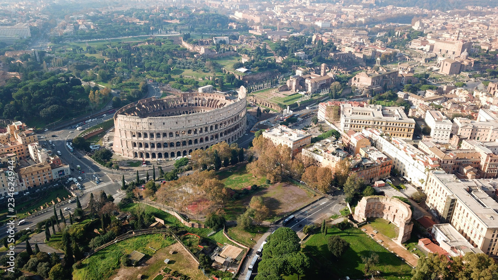 Obraz premium Aerial drone view of iconic ancient Arena of Colosseum, also known as the Flavian amphitheatre in the heart of Rome, Italy