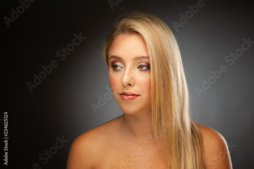 Beauty portrait of a cute blonde caucasian woman with green eyes
