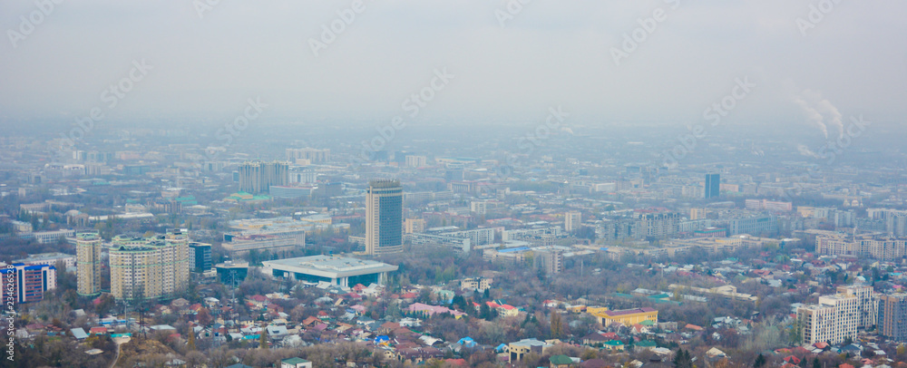Blured view of Almaty skyline.