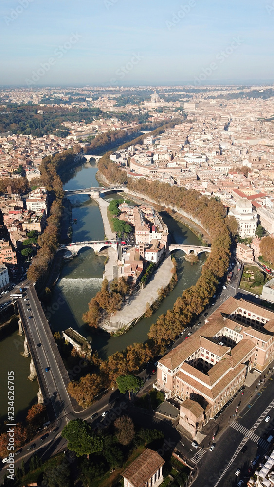 Aerial drone photo of famous Tiber river Island or Isola Tiberina in city of Rome, Italy