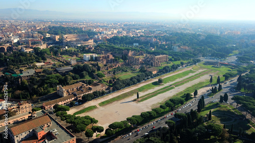 Fototapeta Naklejka Na Ścianę i Meble -  Aerial drone photo of iconic Circus Maximus site of an ancient Roman chariot racing stadium and mass entertainment venue next to famous Colosseum, Rome, Italy