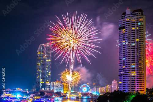Fireworks to celebrate the festival of New Year at Bangkok Thailand. The light reflected the Chao Phraya River.