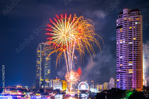 Fireworks to celebrate the festival of New Year at Bangkok Thailand. The light reflected the Chao Phraya River.