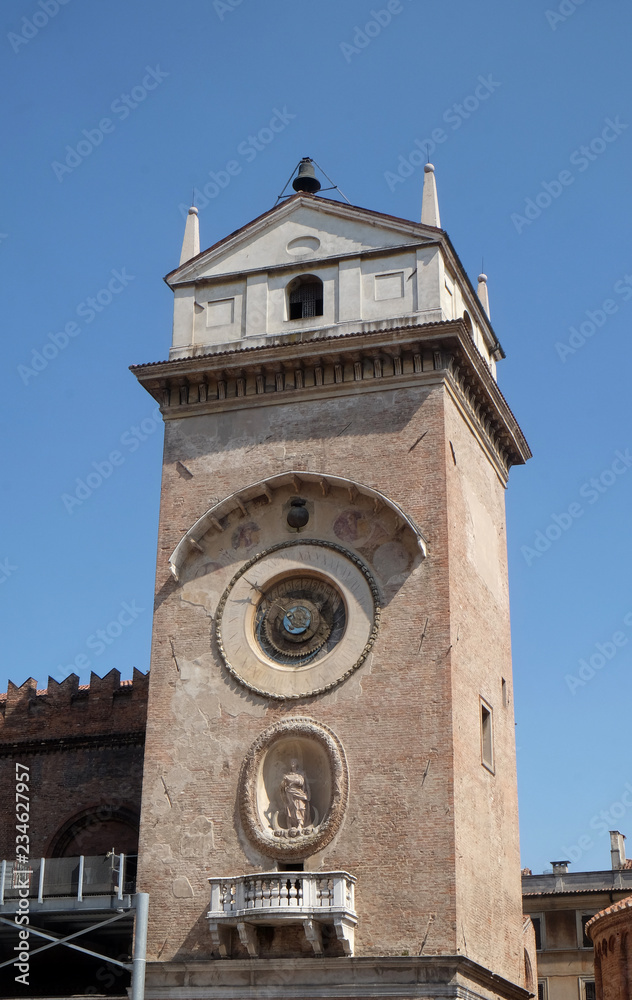 Clock tower of Palace of Reason (Palazzo della Ragione with the Torre dell'Orologio) in Mantua, Italy