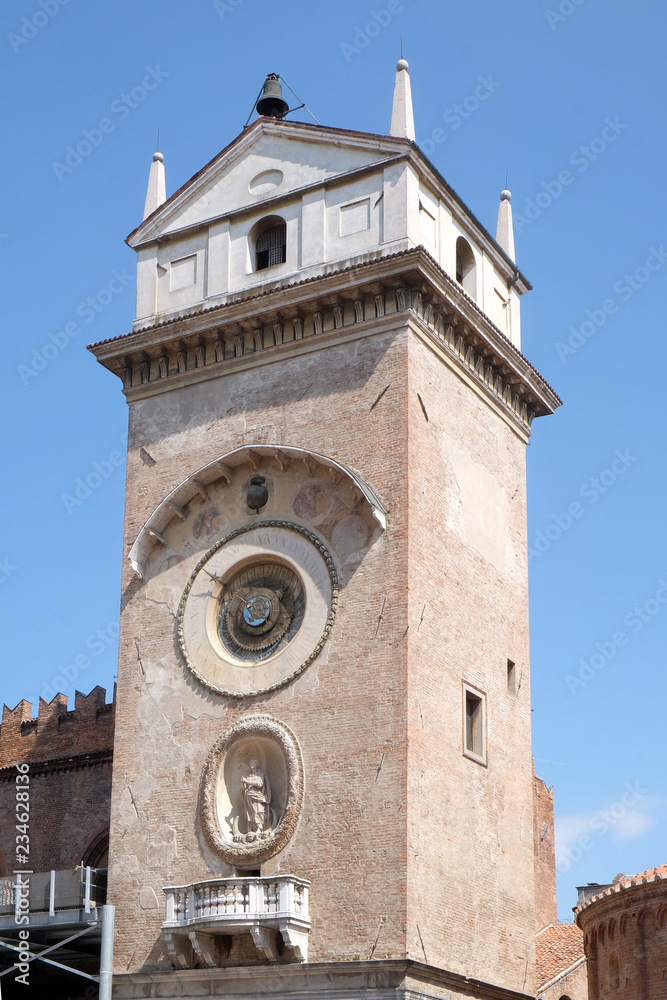 Clock tower of Palace of Reason (Palazzo della Ragione with the Torre dell'Orologio) in Mantua, Italy