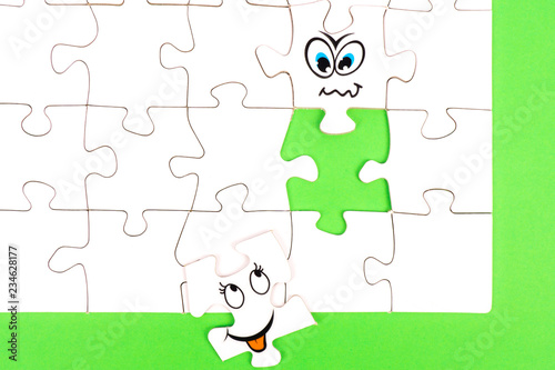 Puzzle pieces with tow funny faces