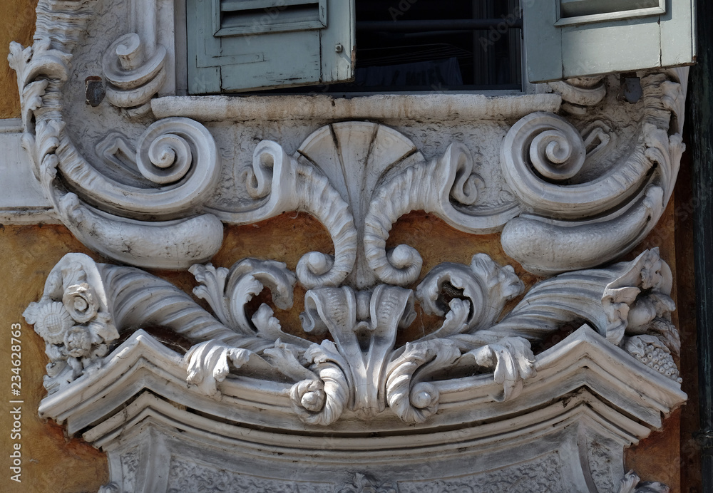 Beautiful house facade with carved stone in Mantua, Italy