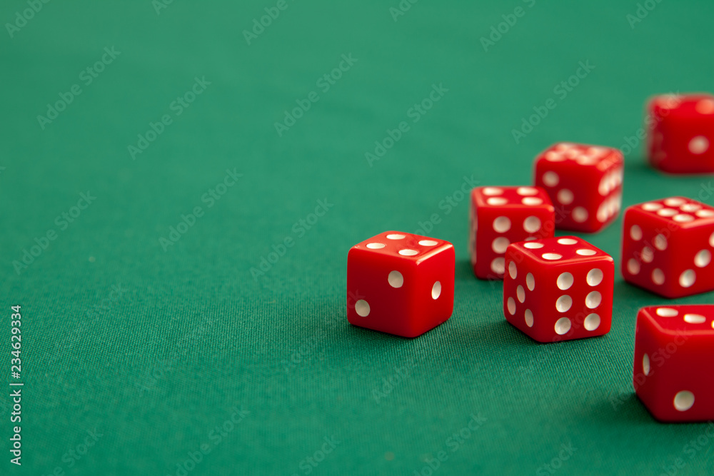 Red dices on green poker gaming table in casino. Concept online gambling. Copy space for text Red dices on green poker gaming table in casino. Concept online gambling. Copy space for text
