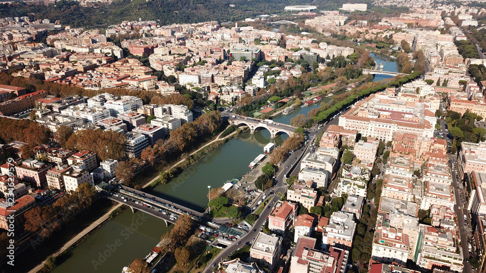 Aerial drone bird's eye view of iconic architecture in city of Rome next to river Tiber, Italy Aerial drone bird's eye view of iconic architecture in city of Rome next to river Tiber, Italy
