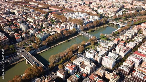 Aerial drone bird's eye view of iconic architecture in city of Rome next to river Tiber, Italy photo