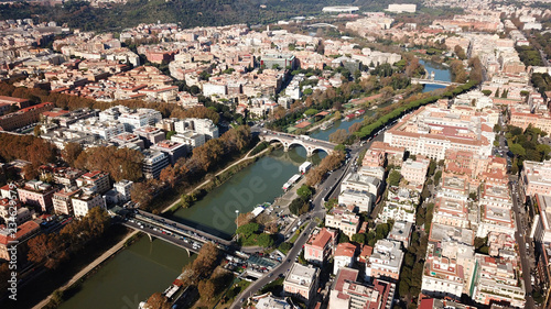 Aerial drone bird's eye view of iconic architecture in city of Rome next to river Tiber, Italy photo