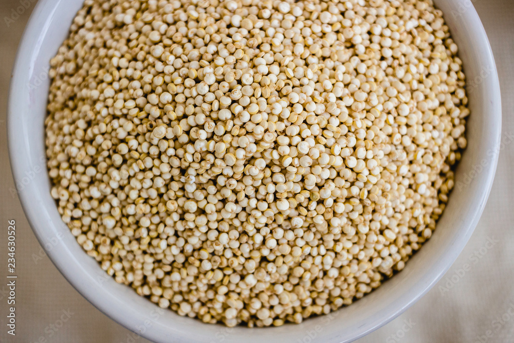 Quinoa in white cup. Raw white quinoa Quinoa in white cup. Raw white quinoa