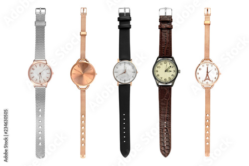 Woman stylish watches. Set of five female watches of various sizes and designs, isolated on white background, clipping paths included. photo