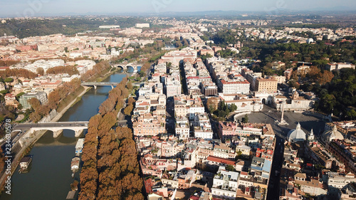 Aerial drone bird's eye view of iconic architecture in city of Rome next to river Tiber, Italy photo