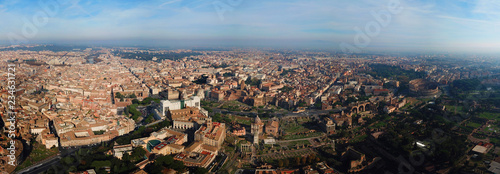 Aerial drone panoramic view from Roman Forum one of the main tourist attractions which was build in ancient times as the site of triumphal processions and elections next to Colosseum, Rome, Italy © aerial-drone