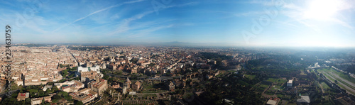 Aerial drone panoramic view from Roman Forum one of the main tourist attractions which was build in ancient times as the site of triumphal processions and elections next to Colosseum, Rome, Italy