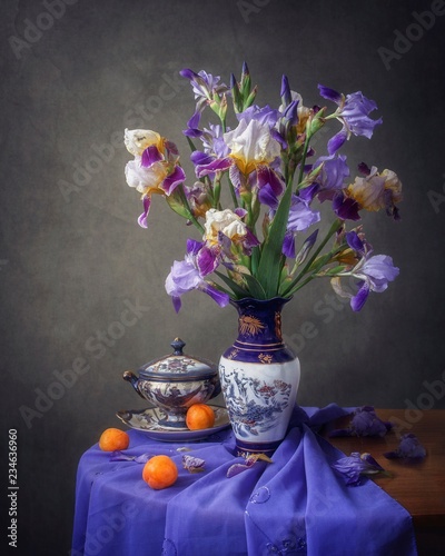 Still life with bouquet beautiful flowers irises photo