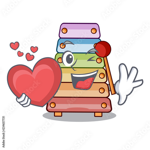 With heart colorful toy xylophone on mallets mascot