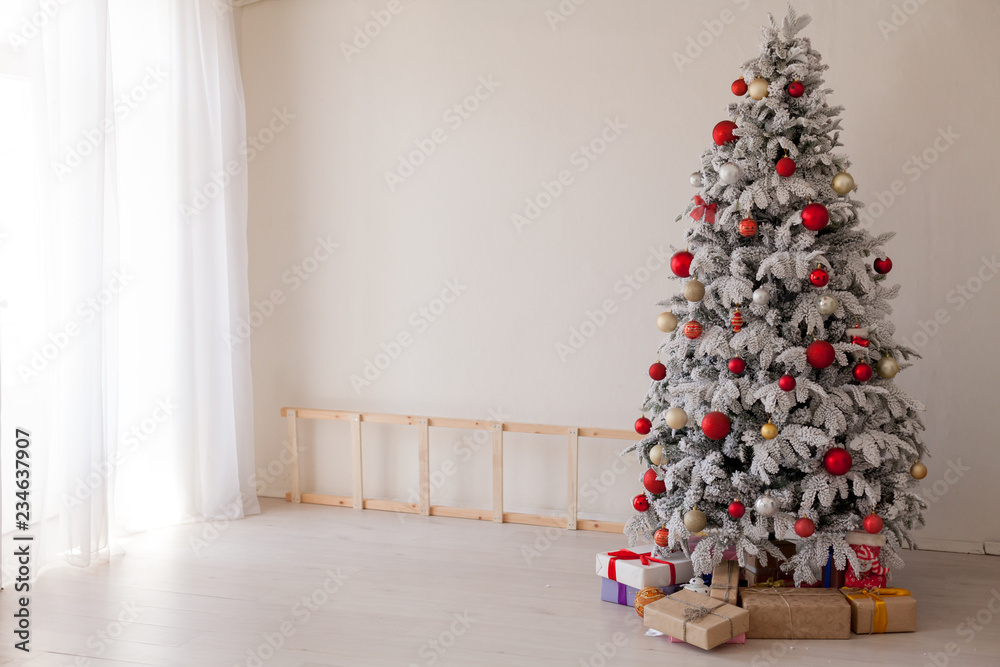 Christmas tree in a room with toys and gifts holiday new year winter postcard