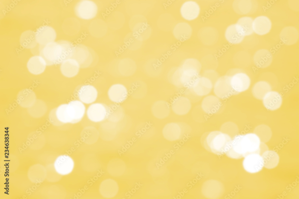 abstract yellow background with defocused glittering lights bokeh                             