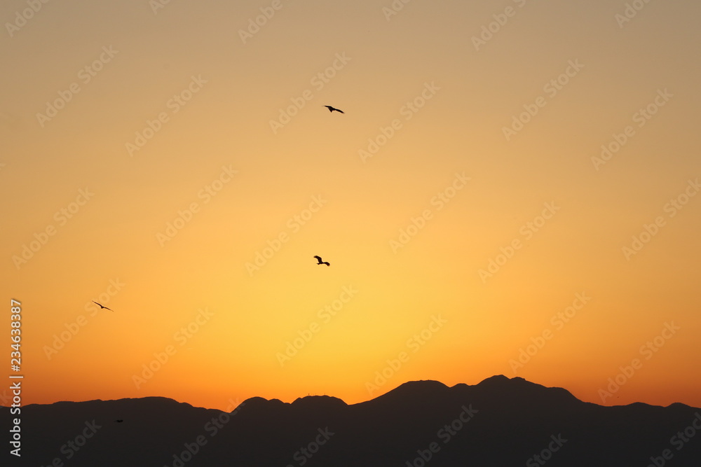 View from Enoshima island to mountain silhouettes with dramatic sunset, Fujisawa, Kanagawa prefecture, Japan View from Enoshima island to mountain silhouettes with dramatic sunset, Fujisawa, Kanagawa prefecture, Japan
