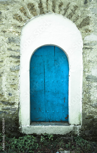 old wooden doors in the old stone building © drutska