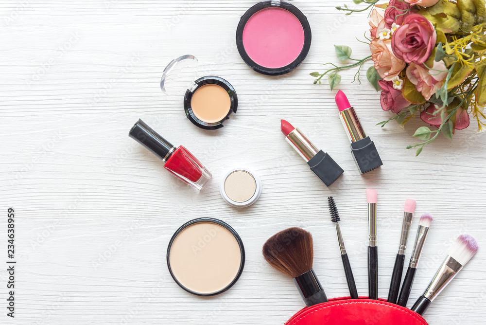 Makeup cosmetics tools background and beauty cosmetics, products and facial cosmetics package lipstick, eyeshadow with rose on the white background, vintage tone. Lifestyle Concept Makeup cosmetics tools background and beauty cosmetics, products and facial cosmetics package lipstick, eyeshadow with rose on the white background, vintage tone. Lifestyle Concept