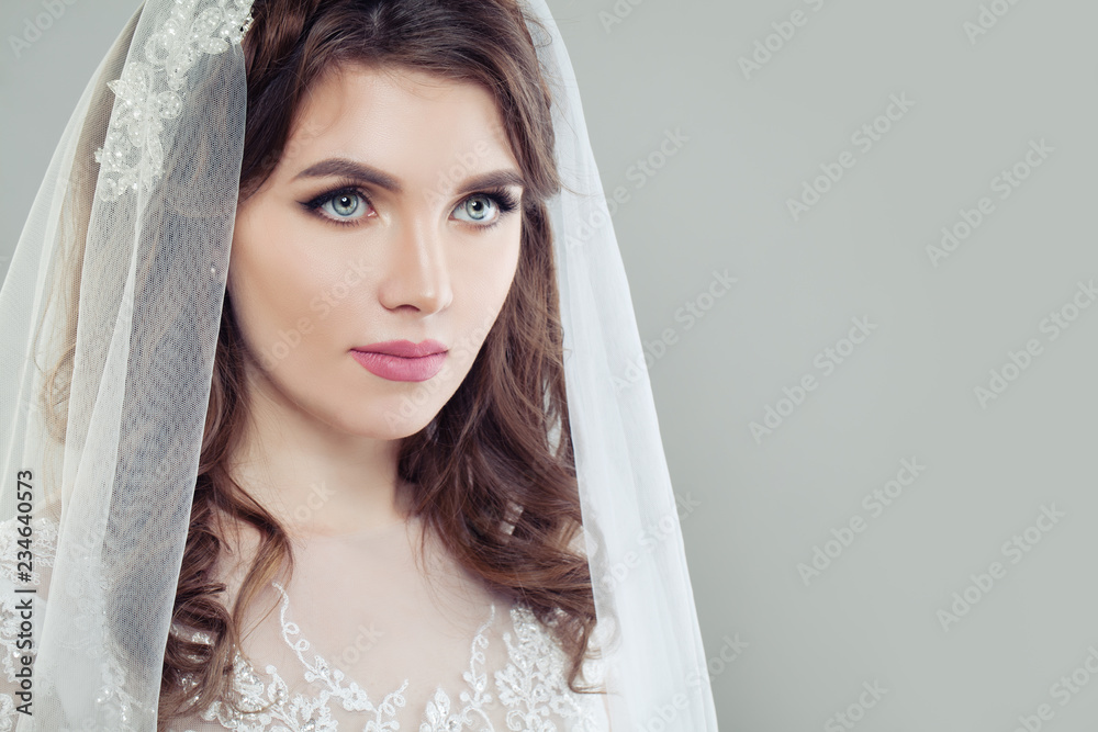 Glamorous bride woman with makeup and veil on background with copy space Glamorous bride woman with makeup and veil on background with copy space