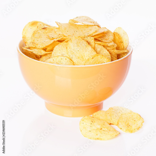 bowl of potato chips or crisps isolated                              