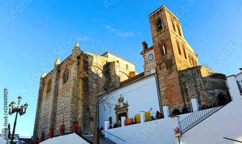 Main Plaza (Plaza Mayor) and Consolation church in Cazalla de la Sierra, a picturesque village in the province of Seville, Spain photo