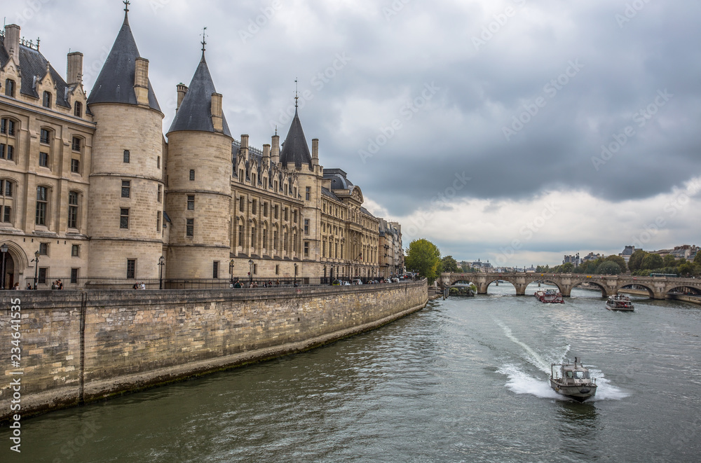 PARIS, FRANCE, SEPTEMBER 6, 2018 - The Conciergerie Castle from the River Seine in Paris, France PARIS, FRANCE, SEPTEMBER 6, 2018 - The Conciergerie Castle from the River Seine in Paris, France