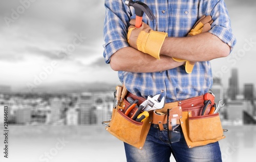 Worker with a tool belt. Isolated over  background. © BillionPhotos.com