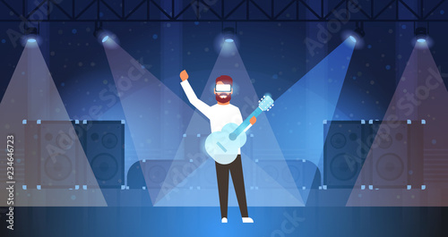 man music guitarist wear digital glasses playing virtual reality guitar on stage light effects disco dance studio vr vision headset innovation concept flat horizontal