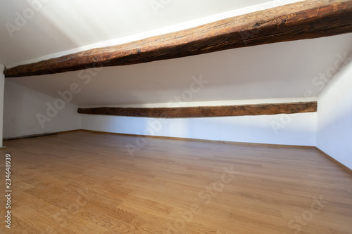 Attic with wooden beams and parquet photo