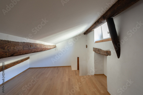 Attic with wooden beams and parquet photo