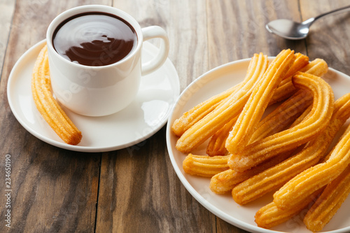 Delicious spanish breakfast with churros and chocolate photo